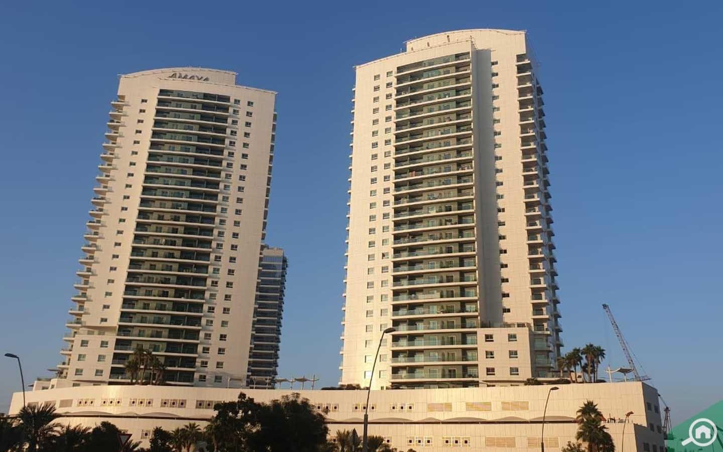 Stunning exterior view of Amaya Towers twin buildings overlooking Arabian Sea in Shams Abu Dhabi